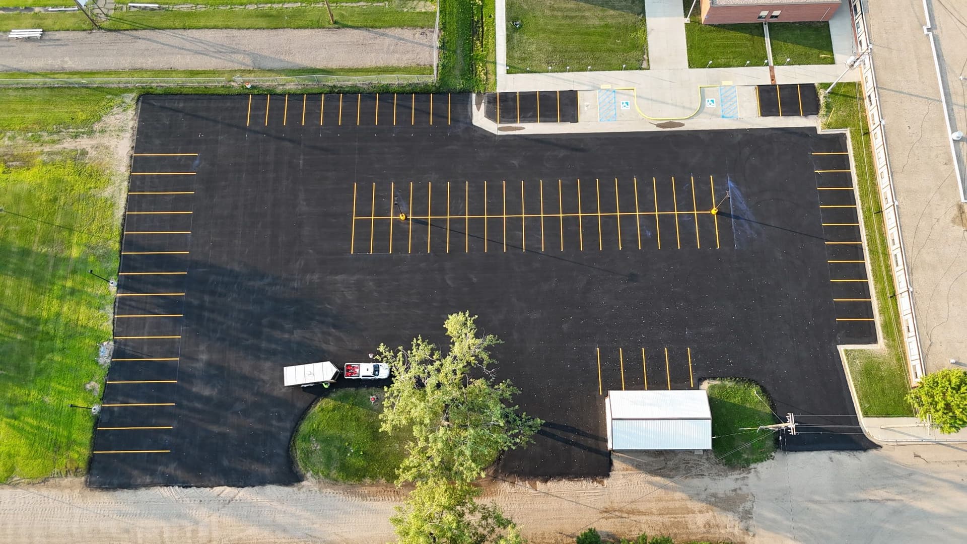 School parking lot sealcoating and line striping in glenburn nd image
